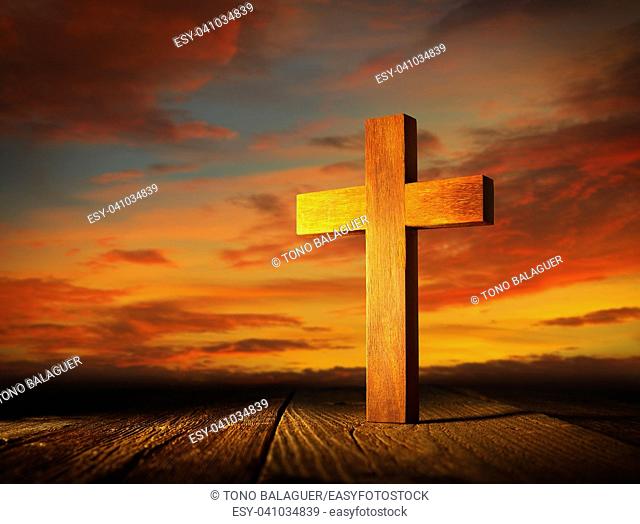 Christian wood cross on sunset sky wooden made