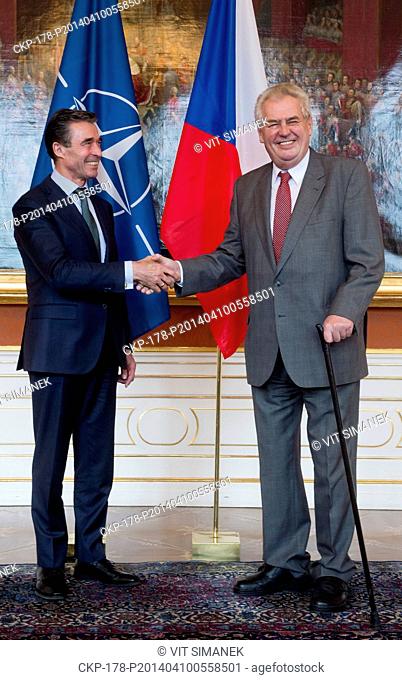 Czech President Milos Zeman, right, welcomes NATO Secretary General Anders Fogh Rasmussen, left, at Prague Castle during his one-day working visit in Prague