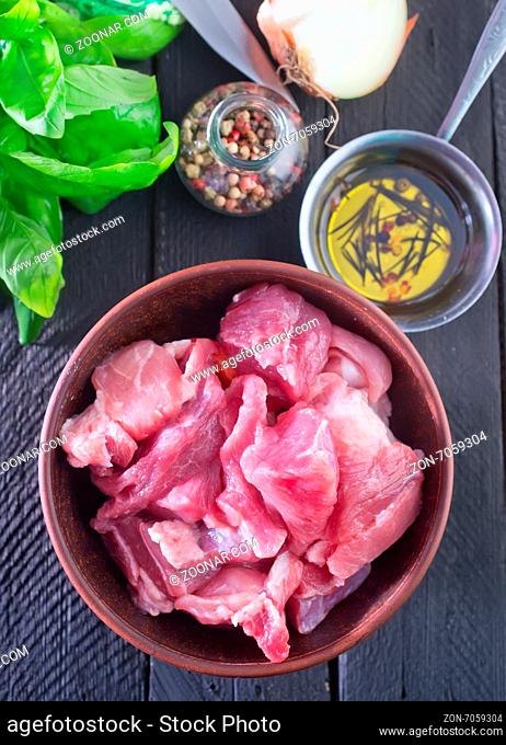 raw meat with salt and spice in the bowl