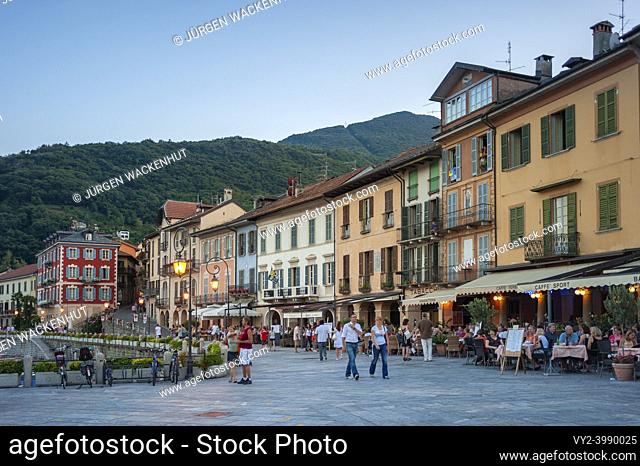 Historic house facades and restaurants along the promenade of Lake Maggiore, Cannobio, Piedmont, Italy, Europe