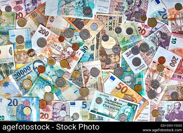 Currencies from around the world, collage of banknotes and coins
