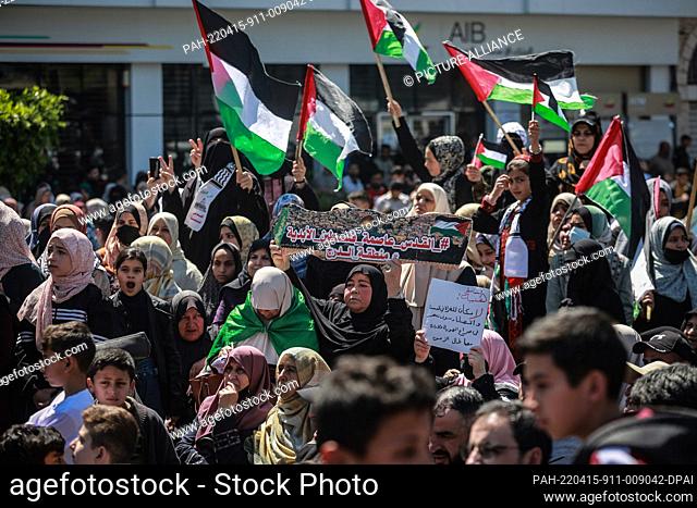15 April 2022, Palestinian Territories, Gaza City: A woman holds a sign that reads ""Jerusalem is the eternal capital of the Palestine"" during a demonstration...