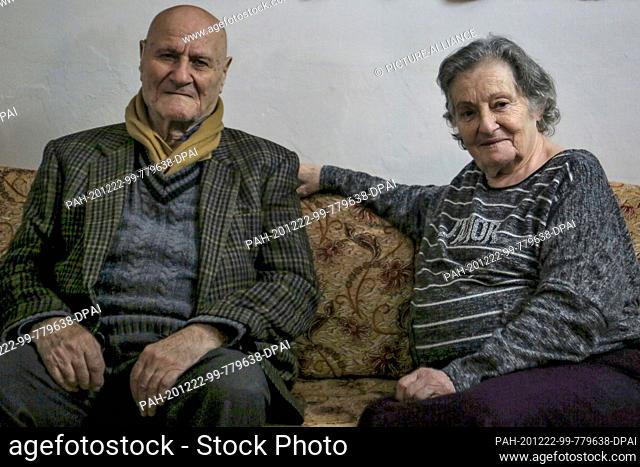 16 December 2020, Lebanon, Beirut: Therese Adib and her husband Hanna sit on a sofa in their apartment. The two regularly visit the food distribution of the aid...