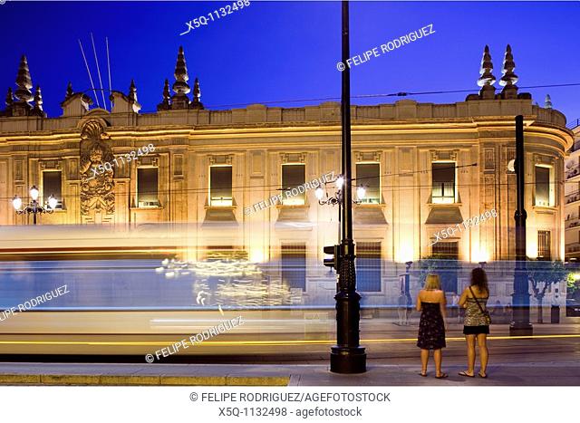 Girls looking the tram passing by, Avenue Constitution, Seville, Spain