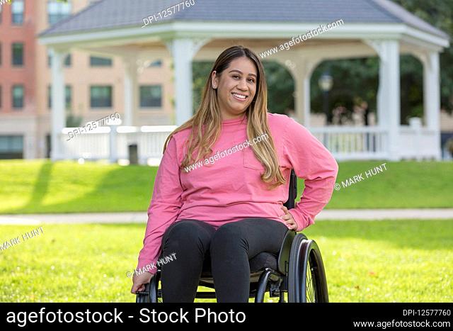 Woman with Spinal Cord Injury sitting in wheelchair in a park