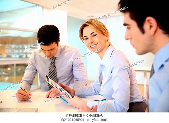Smiling businesswoman attending meeting