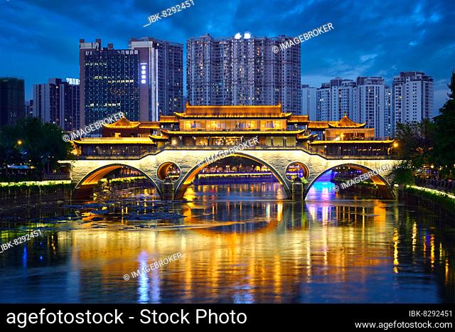 Famous landmark of Chengdu, Anshun bridge over Jin River illuminated at night, Chengdue, Sichuan, China, Asia