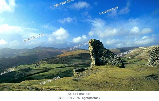 Dinas Bran ruins overlook the town of Llangollen and the Welsh Mountains on a sunny spring day in Clywd Wales Cymru UK United Kingdom GB Great Britain British...