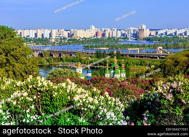 Panorama of the city of Kiev. Ukraine. View of the monastery Vydubitsky, left bank of the Dnieper River and the modern part of town. Kyiv