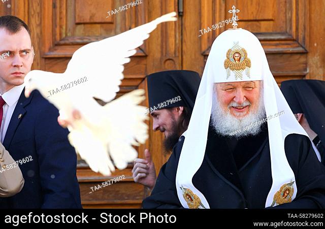 RUSSIA, MOSCOW - APRIL 7, 2023: Patriarch Kirill (R) of Moscow and all Russia releases a dove into the sky to mark the feast of Annunciation outside the...
