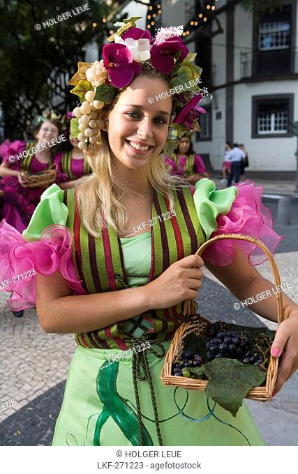 Young woman in colourful costume at the Madeira Wine Festival, Funchal, Madeira, Portugal