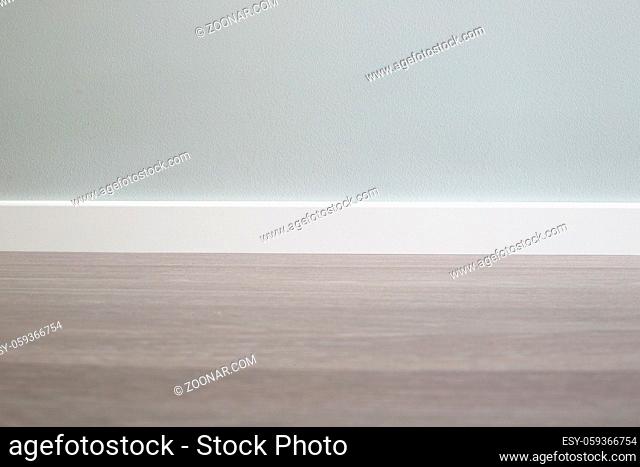 Empty wall and floor background of scandinavian room interior with white plinth close up , copy space for text , renovation , new home ownership concept