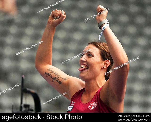 25 June 2022, Berlin: Athletics: German Championships, decisions at the Olympic Stadium. Discus throw, women. Kristin Pudenz, SC Potsdam, celebrates her victory