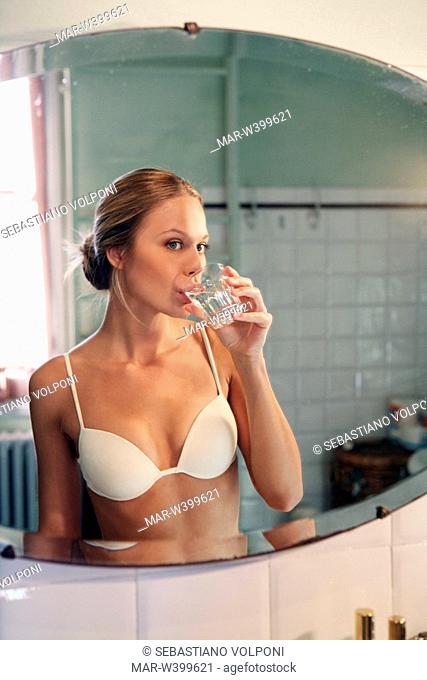 young woman drinking water