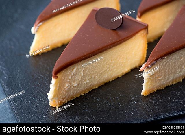 appetizing cake on a black plate