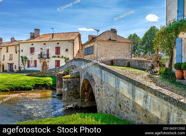 Old stone bridge in Saint-Jean-de-Cole village, Dordogne departement, France