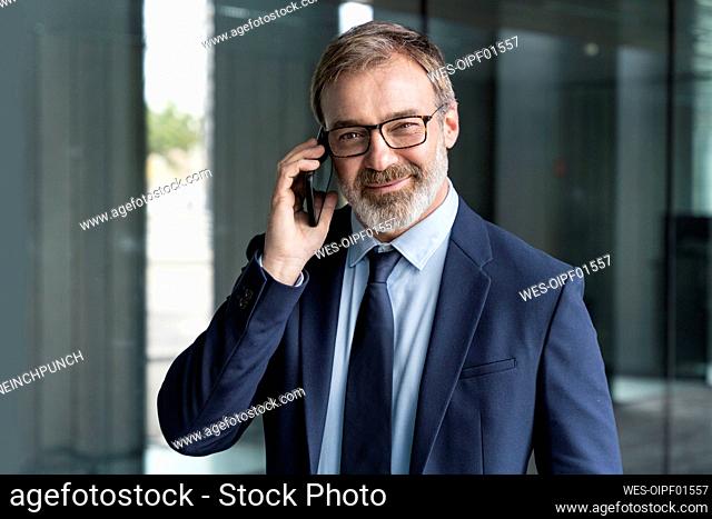 Businessman in suit talking on smart phone