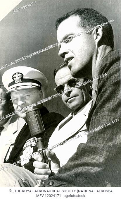 Capt Leroy Cooper, right, with Admiral Hills and Joachim Kuettner at Cape Canaveral after witnessing the launch of a Mercury capsule carrying a chimpanzee on...