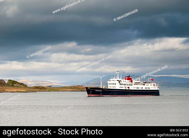 Cruise ship Hebridean Princess sails past the island on her way into Oban Harbour, Kerrera, Inner Hebrides, Argyll, Scotland, United Kingdom, Europe