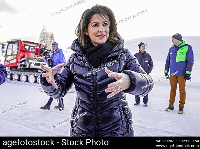 07 December 2023, Bavaria, Reit im Winkl: Bavaria's Minister of Agriculture Michaela Kaniber (CSU) stands on the ski slope on the Winklmoos-Alm at the opening...