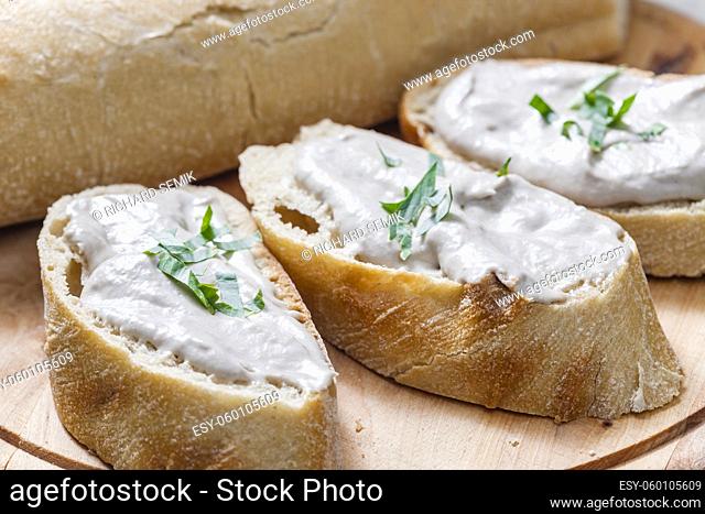 anchovy spread on white baguette