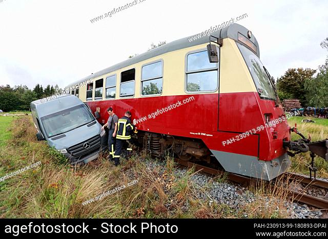 13 September 2023, Saxony-Anhalt, Benneckenstein: A railcar of the Harzer Schmalspurbahnen GmbH collided with a van at an ungated level crossing in...