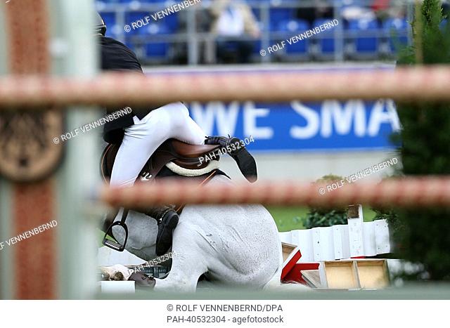 German show jumper David Will jumps over a hurdle on his horse Colorit during the Preis von Europa at CHIO in Aachen,  Germany, 26 June 2013