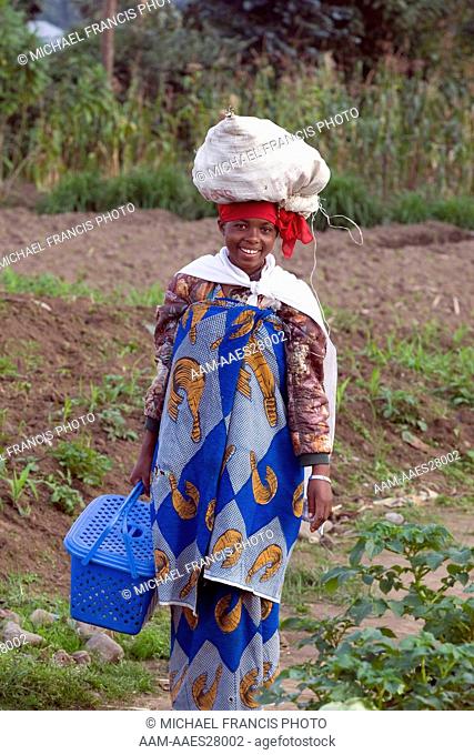 Rwanda, woman with bag on head, Volcanoes National Park, Ruhengeri, Virunga Mountains, Rwanda