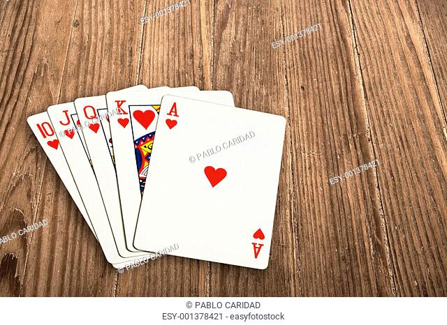 poker cards over an old wooden table