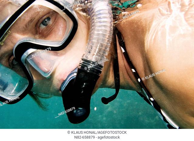 Reef woman snorkeling underwater in Red Sea
