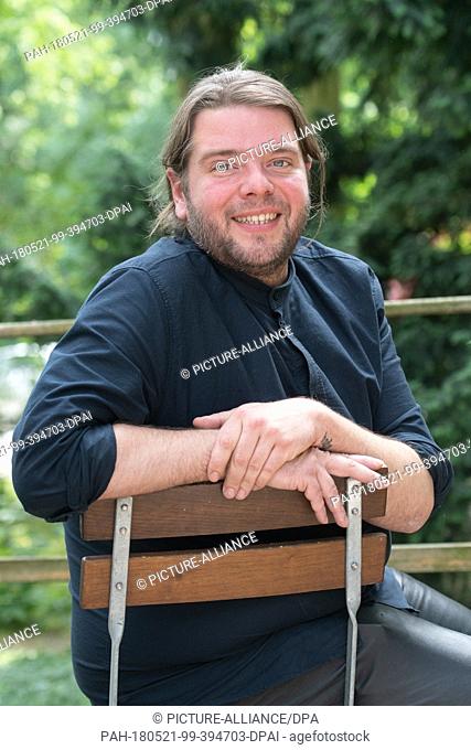 21 May 2018, Germany, Berlin: Belgian theatre and film actor Benny Claessens looking into the camera before the Berliner Festspiele building