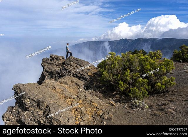 Woman looking up at El Golfo, west coast, hiking trail to the highest point, Pico Malpaso, El Hierro, Canary Islands, Spain, Europe