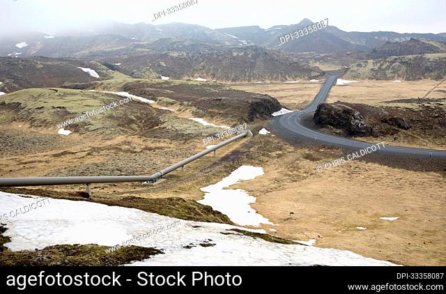 Geothermal hot water pipeline and road in rural Iceland; Southern Region, Iceland
