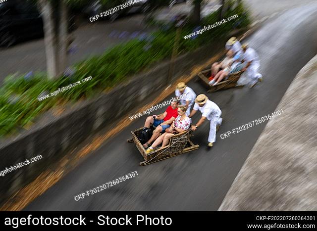 Traditional Monte Toboggans sledge (Carrinhos de Monte) slide from Monte to Funchal on the Portuguese island of Madeira on July 18, 2022