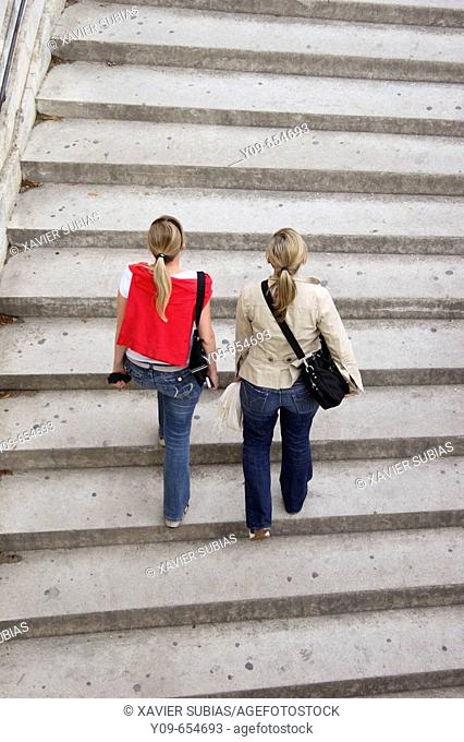 Women climbing stairs. Avignon, Vaucluse. Provence-Alpes-Côte d'Azur. France