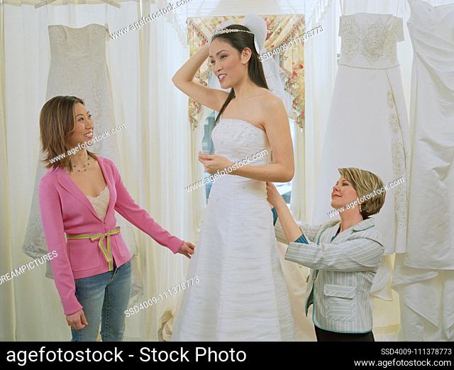 Young bride-to-be trying on her gown