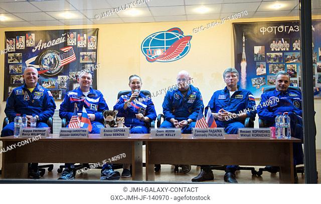Expedition 41 prime crew members Flight Engineer Barry Wilmore of NASA, far left, Soyuz Commander Alexander Samokutyaev of the Russian Federal Space Agency...