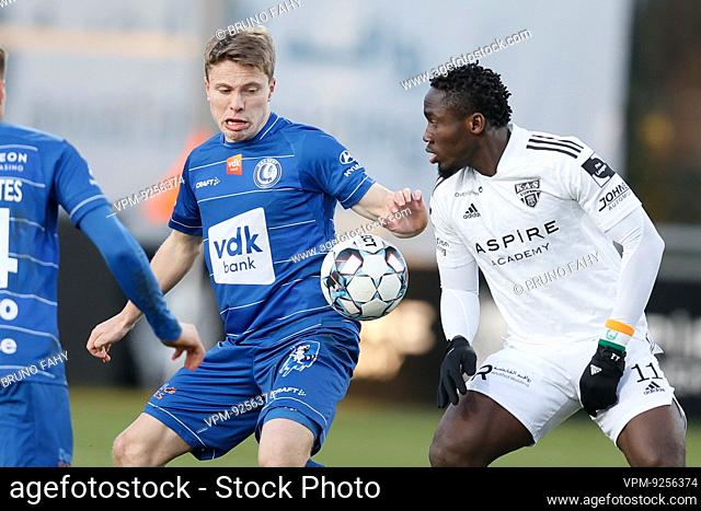 Gent's Matisse Samoise and Eupen's Konan Ignace N'Dri fight for the ball during a soccer match between KAS Eupen and KAA Gent