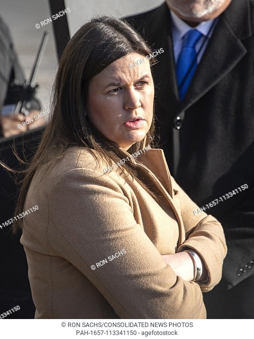 White House Press Secretary Sarah Huckabee Sanders looks on as United States President Donald J. Trump makes remarks to the press at the White House in...