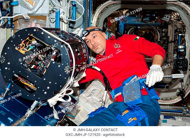 European Space Agency astronaut Luca Parmitano, Expedition 36 flight engineer, works on the Multi-User Droplet Combustion Apparatus (MDCA) Chamber Insert...