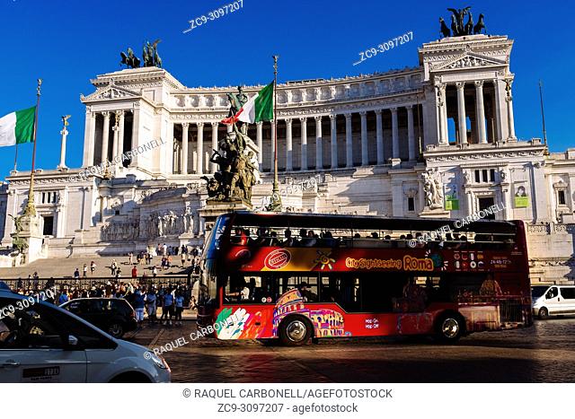 Tourists bus in front of Monument to Victor Emmanuel II, Rome, Lazio region, Italy