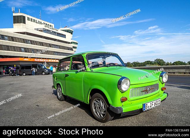 03.10.2020, Berlin, a bright green Trabant 601 Universal (station wagon) on the 30th day of German reunification at Berlin-Tegel Otto Lilienthal TXL airport in...