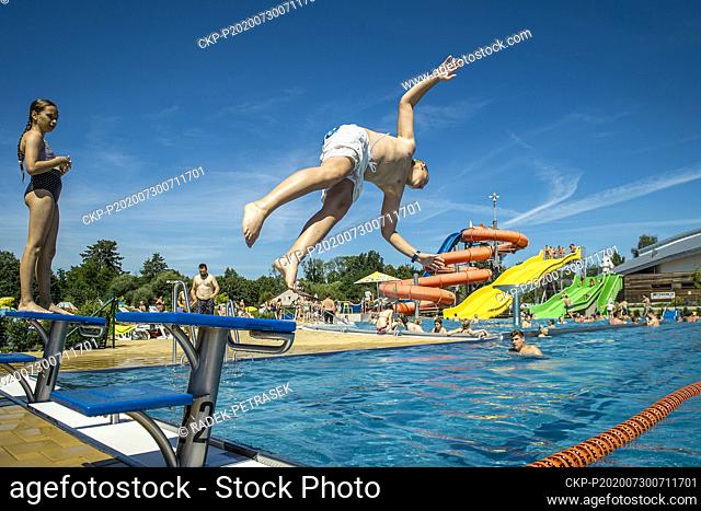 People enjoy hot weather in swimming pool aquapark Maskova zahrada in Turnov, Czech Republic, July 30, 2020. (CTK Photo/Radek Petrasek)