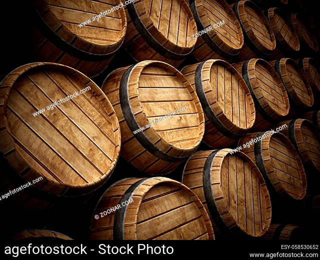 Wine cellar with stack of wooden barrels
