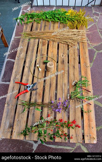 table with utensils for handicrafts, grasses, flowers, rose shears, thistle, greenery, rope, table, terrace, europe, germany, bavaria, upper bavaria, werdenfels