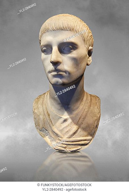 Roman portrait bust of a young man from the rule of Trajan 98-117 AD. This bust of a man presents a hairstyle with long curls that are closely cut to the head...