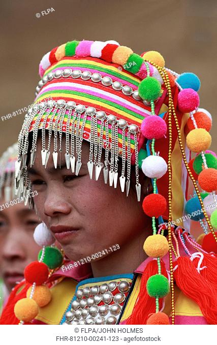 Lisu ethnic minority tribe, dancer in traditional clothing, close-up of head, Husa, West Yunnan, China, march