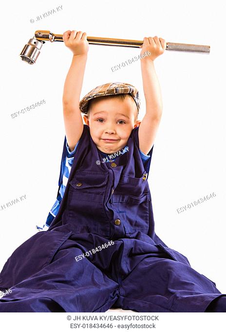 Little boy and heavy socket wrench, white background