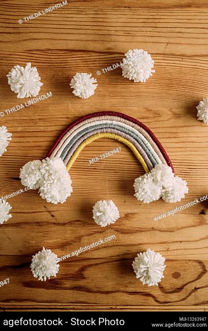 Macrame rainbow with white pompons