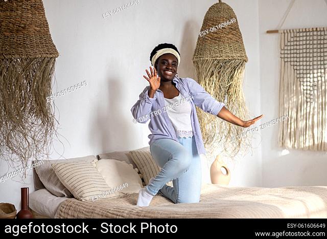 Ethnic interior. African woman in a bedroom with ethnic interior